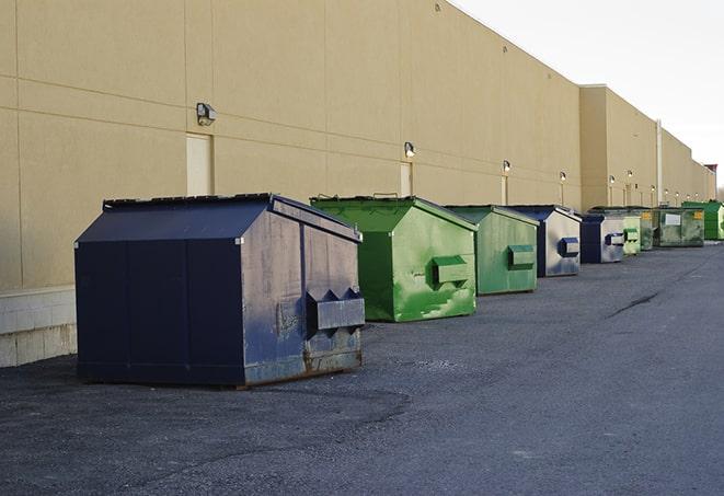 multiple construction dumpsters at a worksite holding various types of debris in Tarpon Springs FL